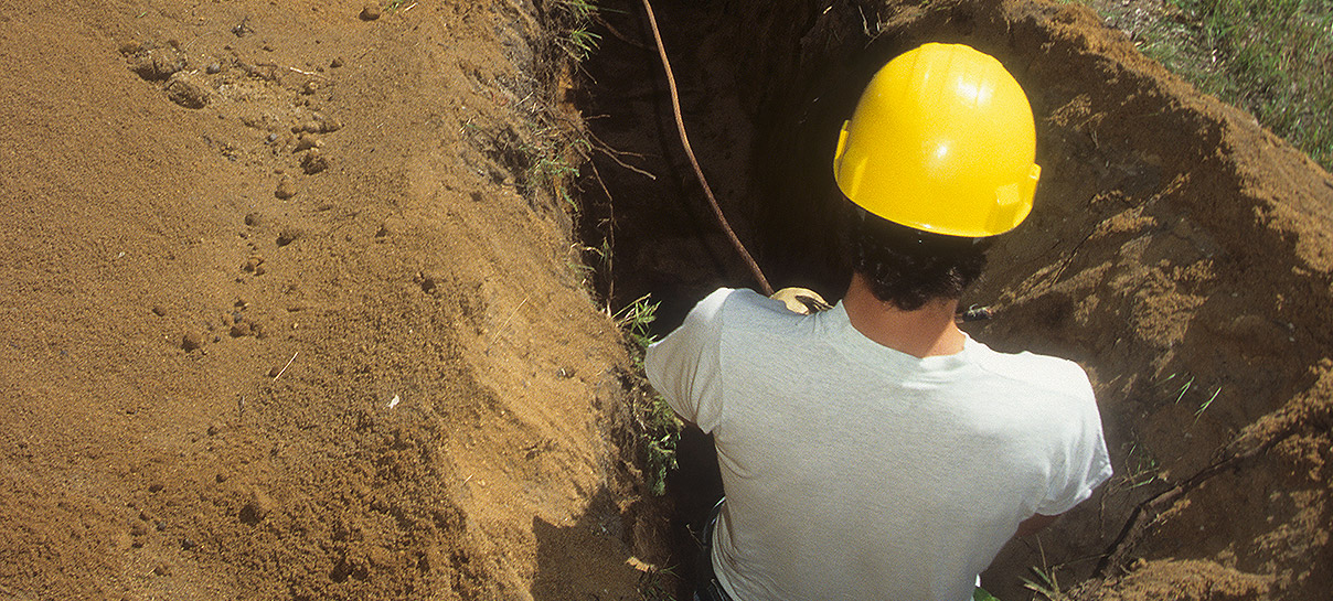 Man working in AC Mitigation Ditch | SAE Inc.